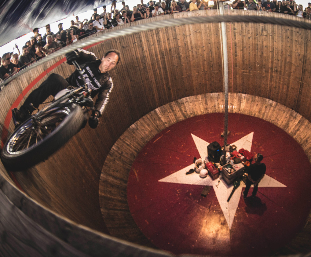 Wall of Death stunt show featuring thrilling motorcycle stunts